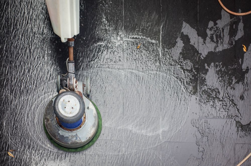 Floor Cleaner Scrubbing A Wet, Dark Tile Floor — Stihl Shop Atherton In Mareeba, QLD