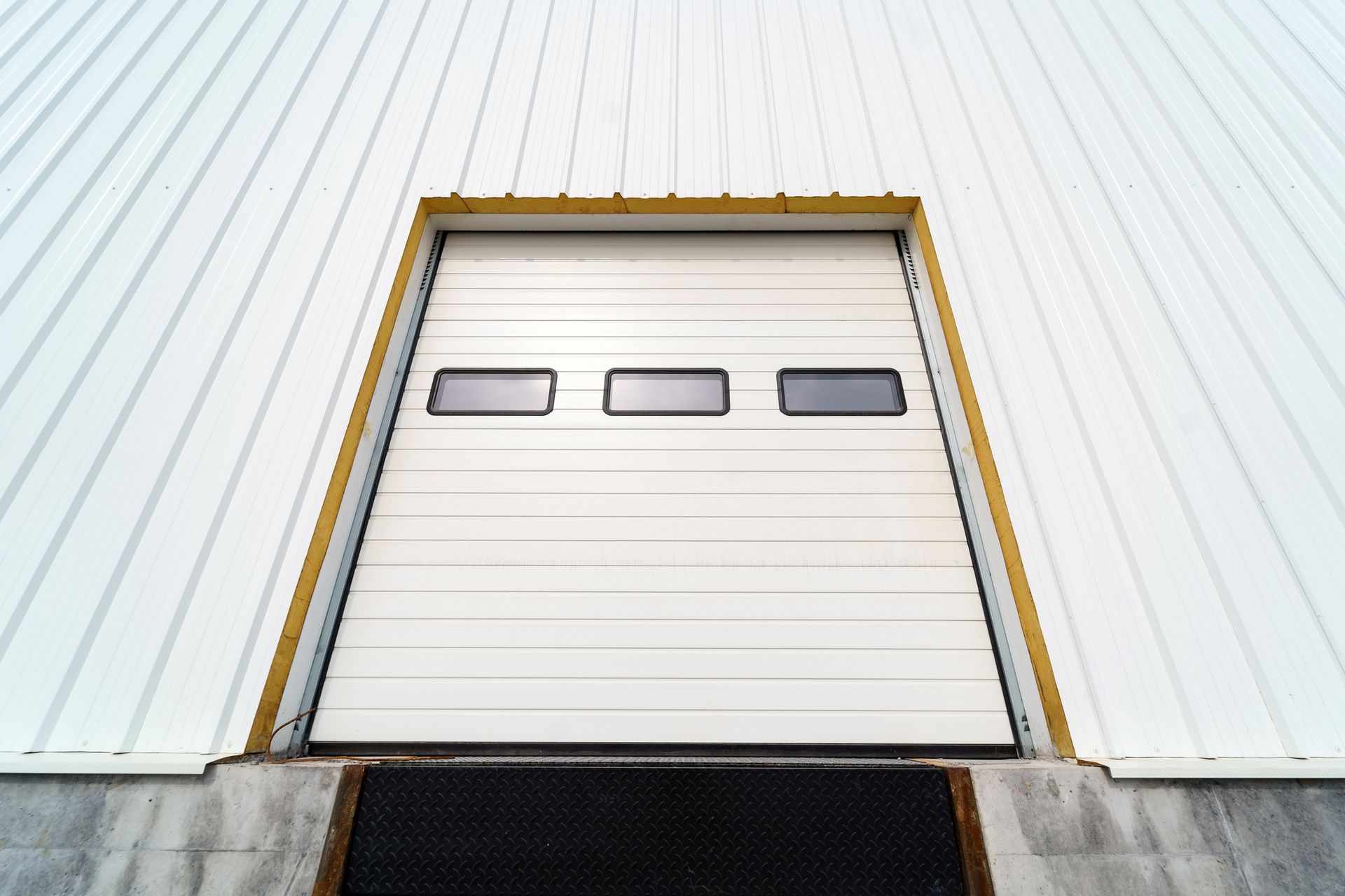 Sectional warehouse overhead door for loading and unloading cargo in a distributed center. Sectional warehouse overhead door for loading and unloading cargo in a distributed center.