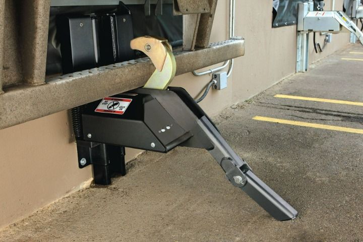 A row of loading docks with warning signs on them