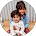 A woman is holding a baby in her arms in a circle.