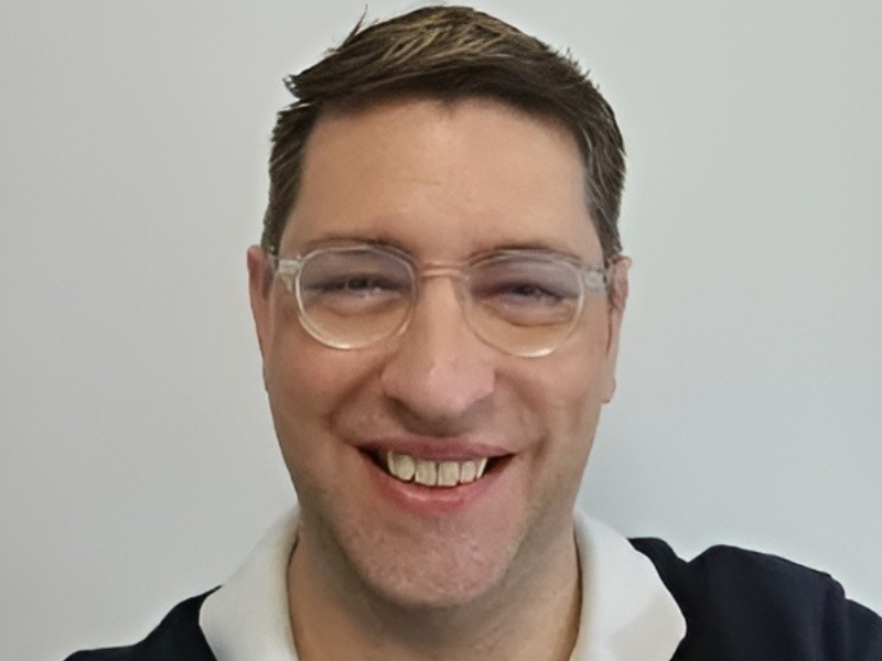 Dr Andrew Wotherspoon, founder of Tutorio Tutoring in clear framed glasses in Camperdown