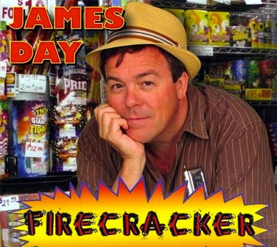 Man in a straw hat leans on his hand in a fireworks store. Red 