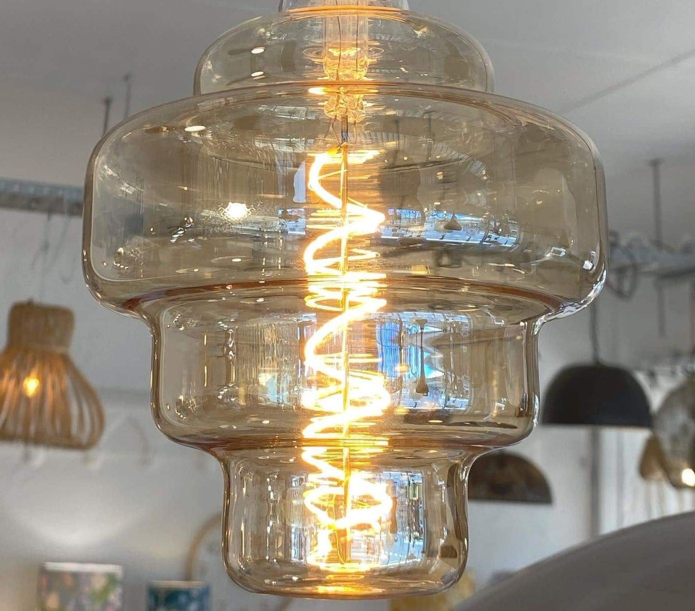 A Dining Room With a Table and Chairs and a Chandelier — Brightway Lighting in Lismore, NSW