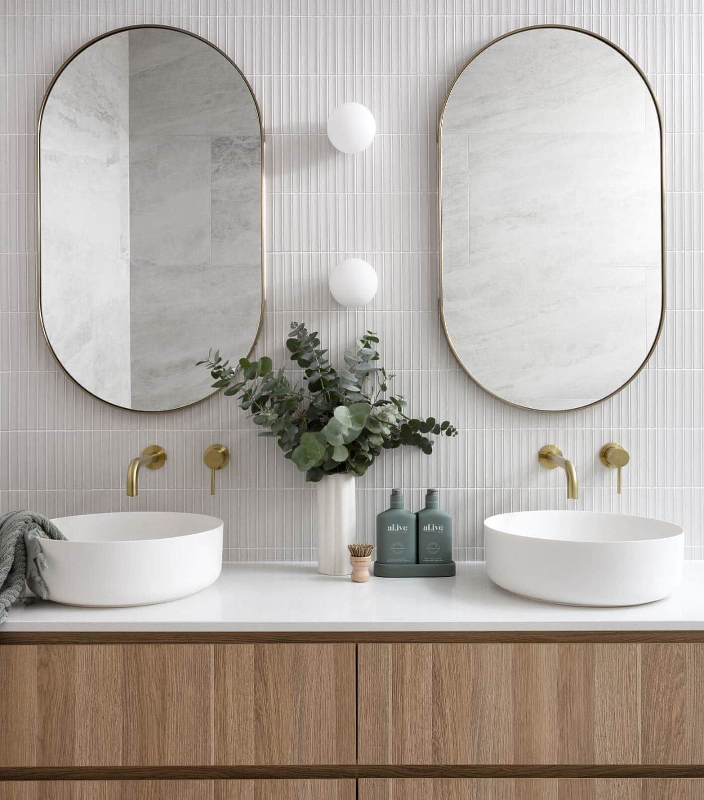 A Lamp is Sitting on a Table Next to a Chair — Brightway Lighting in Lismore, NSW