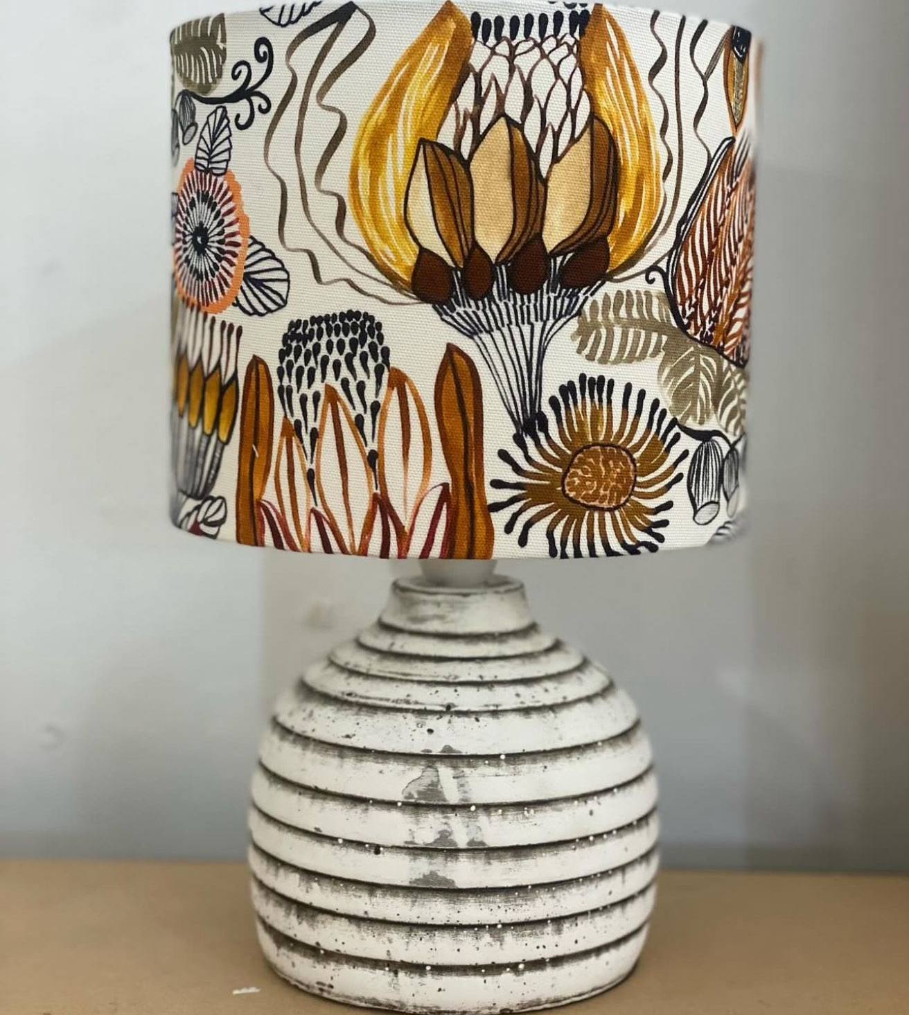 Lamp with a floral patterned lampshade on a white, textured base — Brightway Lighting in Lismore, NSW