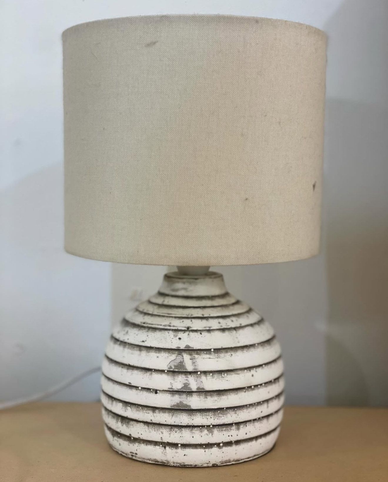 White, ribbed ceramic table lamp with a beige drum shade — Brightway Lighting in Lismore, NSW
