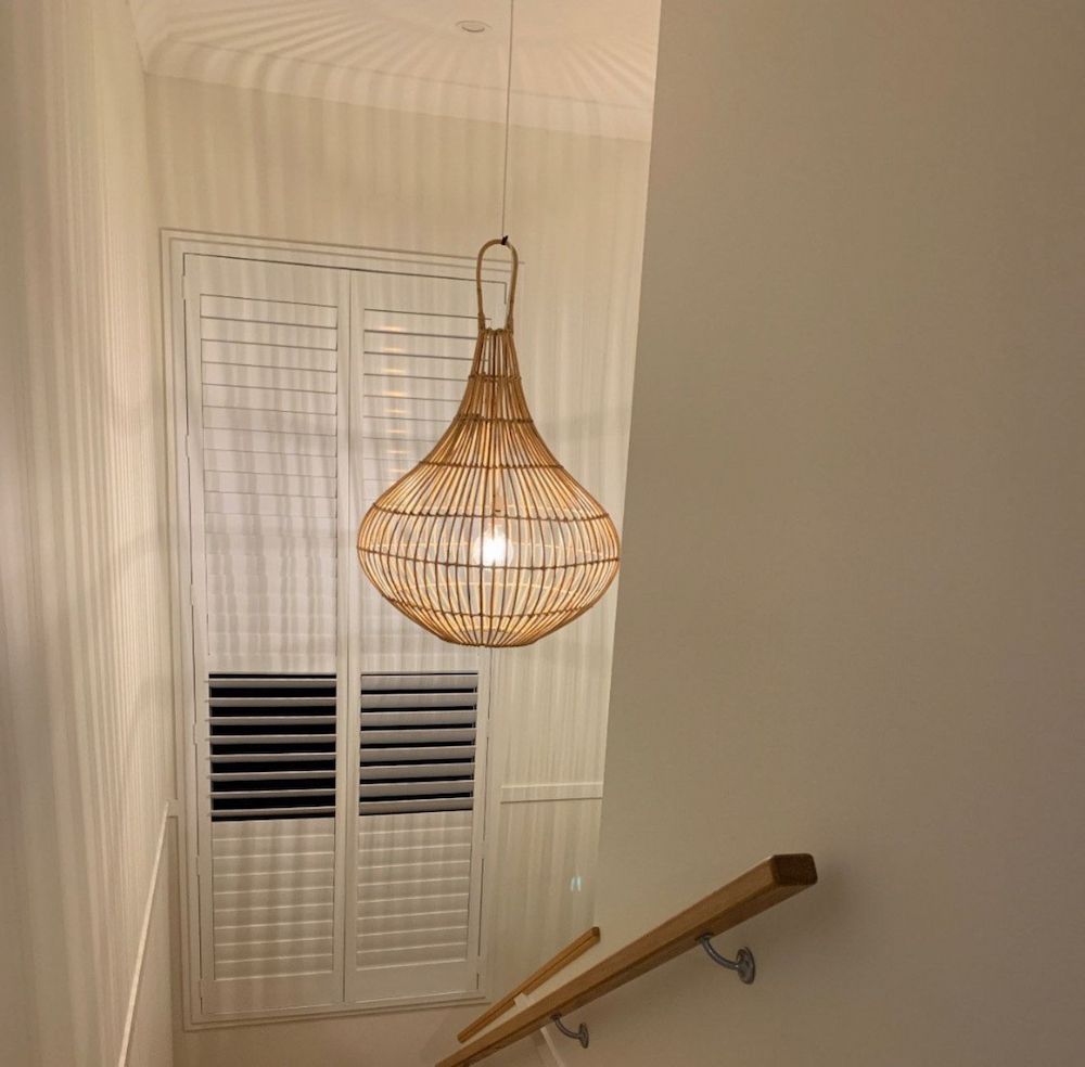 Woven Rattan Pendant Lamp Hangs Above a Stairway — Brightway Lighting in Lismore, NSW