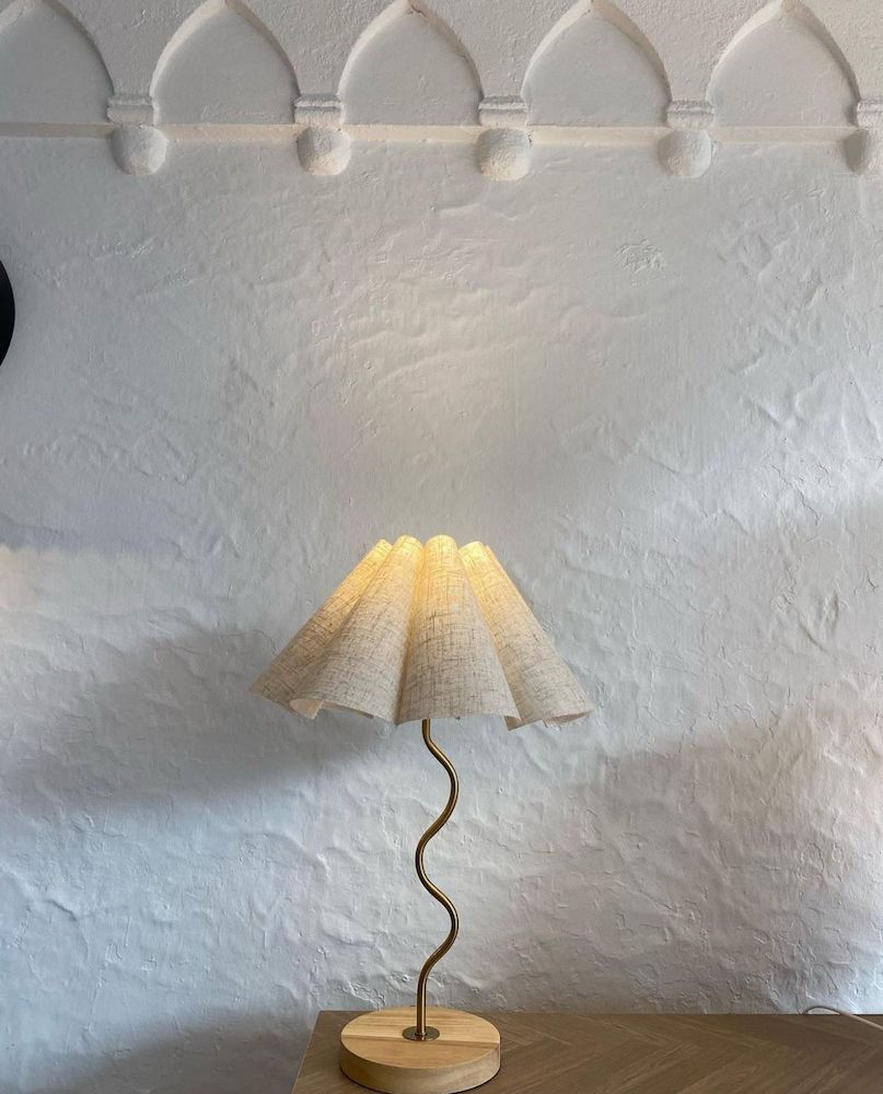 A Clear Glass Pendant Light is Hanging From the Ceiling — Brightway Lighting in Lismore, NSW