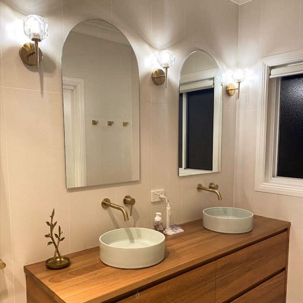 Bathroom With Two Sinks, Arch Mirrors, and Sconces — Brightway Lighting in Lismore, NSW