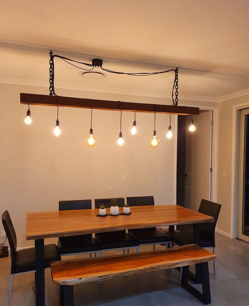 Dining Room Illuminated by a Hanging Light Fixture — Brightway Lighting in Lismore, NSW