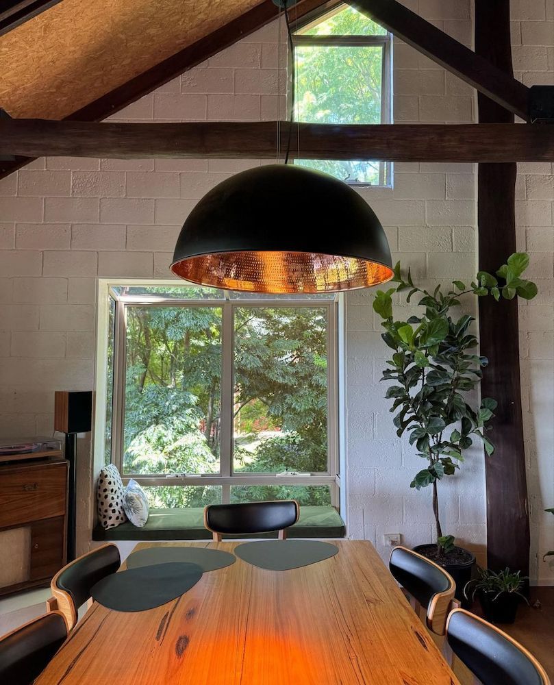 Dining Room With a Large Black Pendant Light — Brightway Lighting in Lismore, NSW