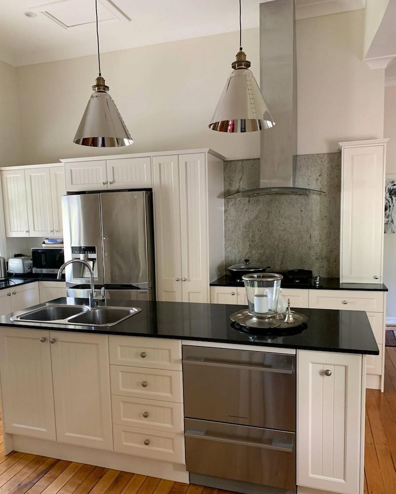 Kitchen With White Cabinets and Two Pendant Lights — Brightway Lighting in Lismore, NSW