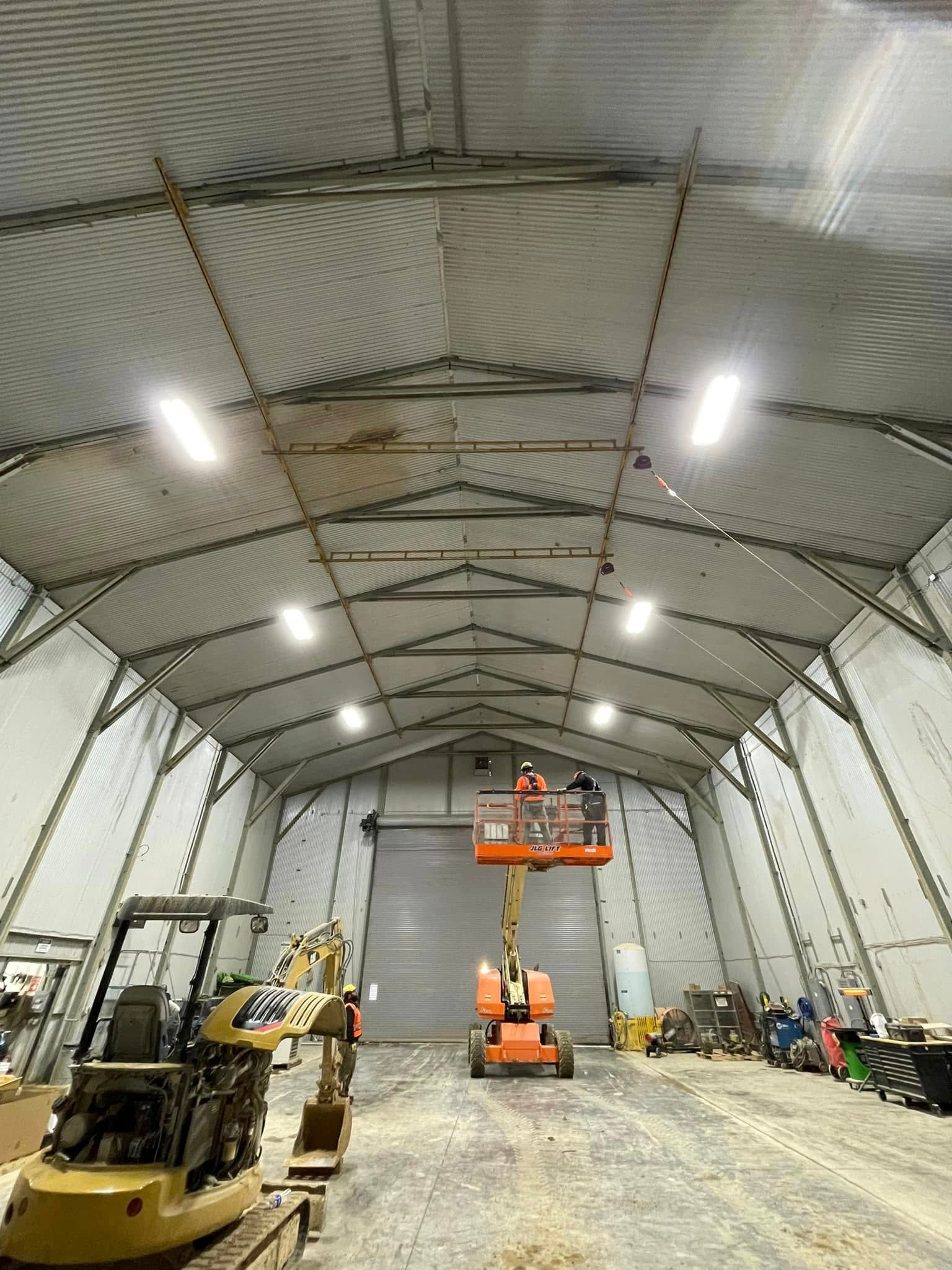A covered outdoor patio with a view of a pool and green space.