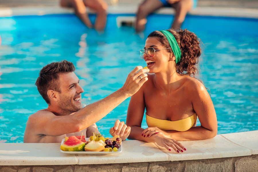 Couple On The Pool Side — Liverpool, NY — CoolWaters Pool & Spa