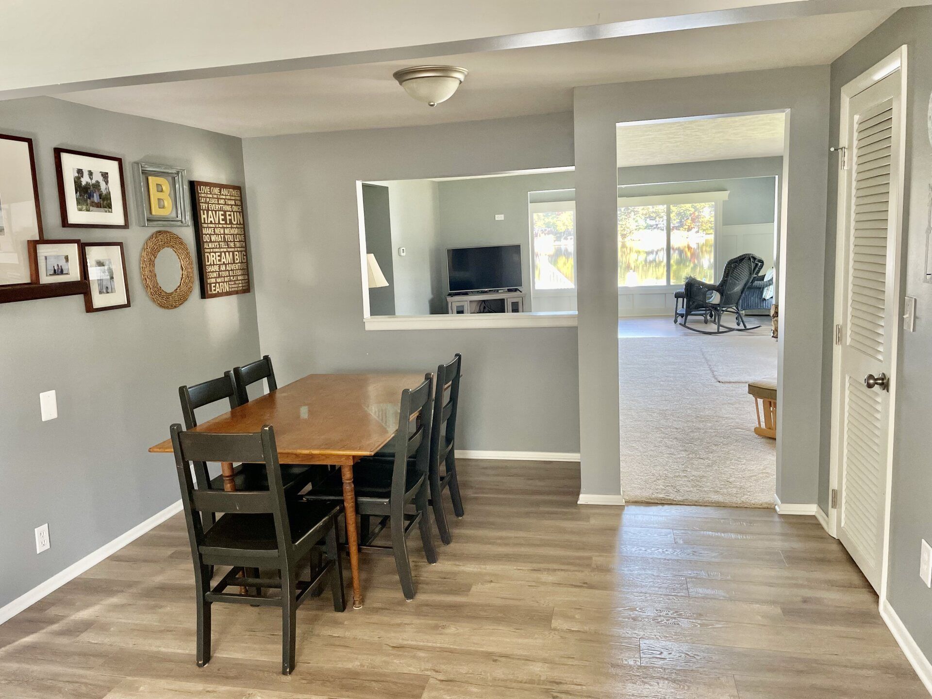 A dining room with a table and chairs in a house.