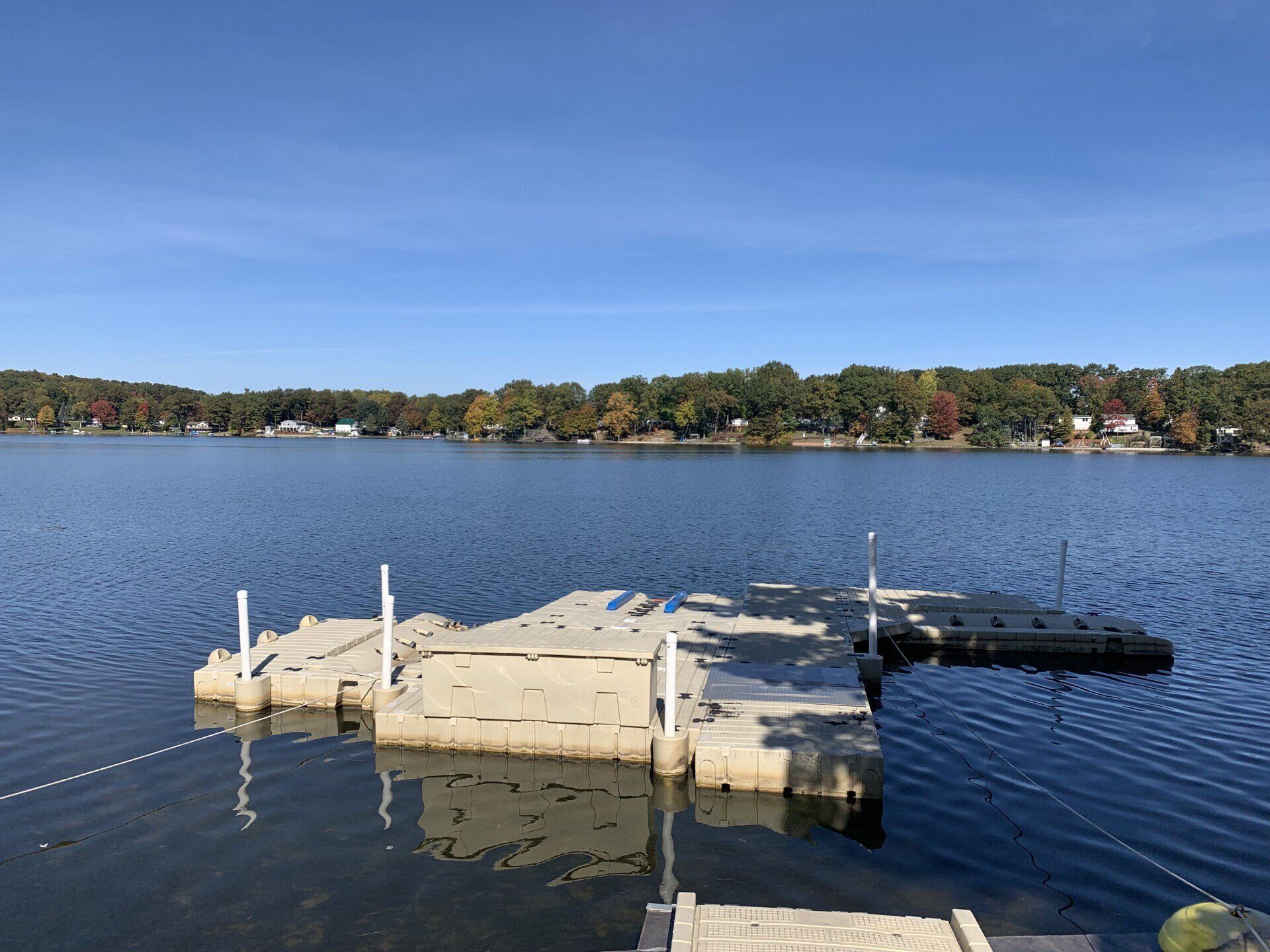 A large body of water with a dock in the middle of it.