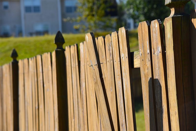 A wooden staircase with a glass railing in a house.
