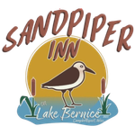 A logo for sandpiper inn lake bernice with a bird