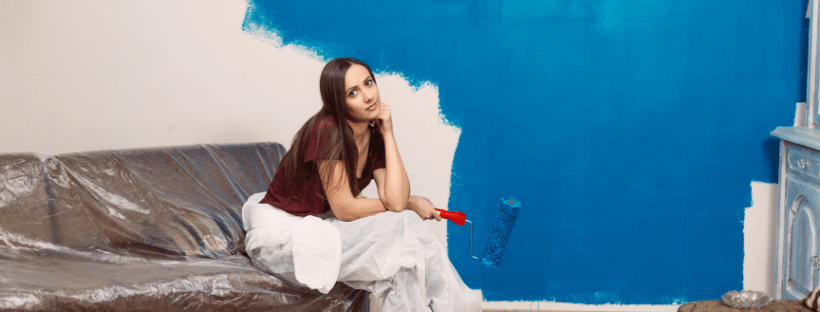 woman painting a wall
