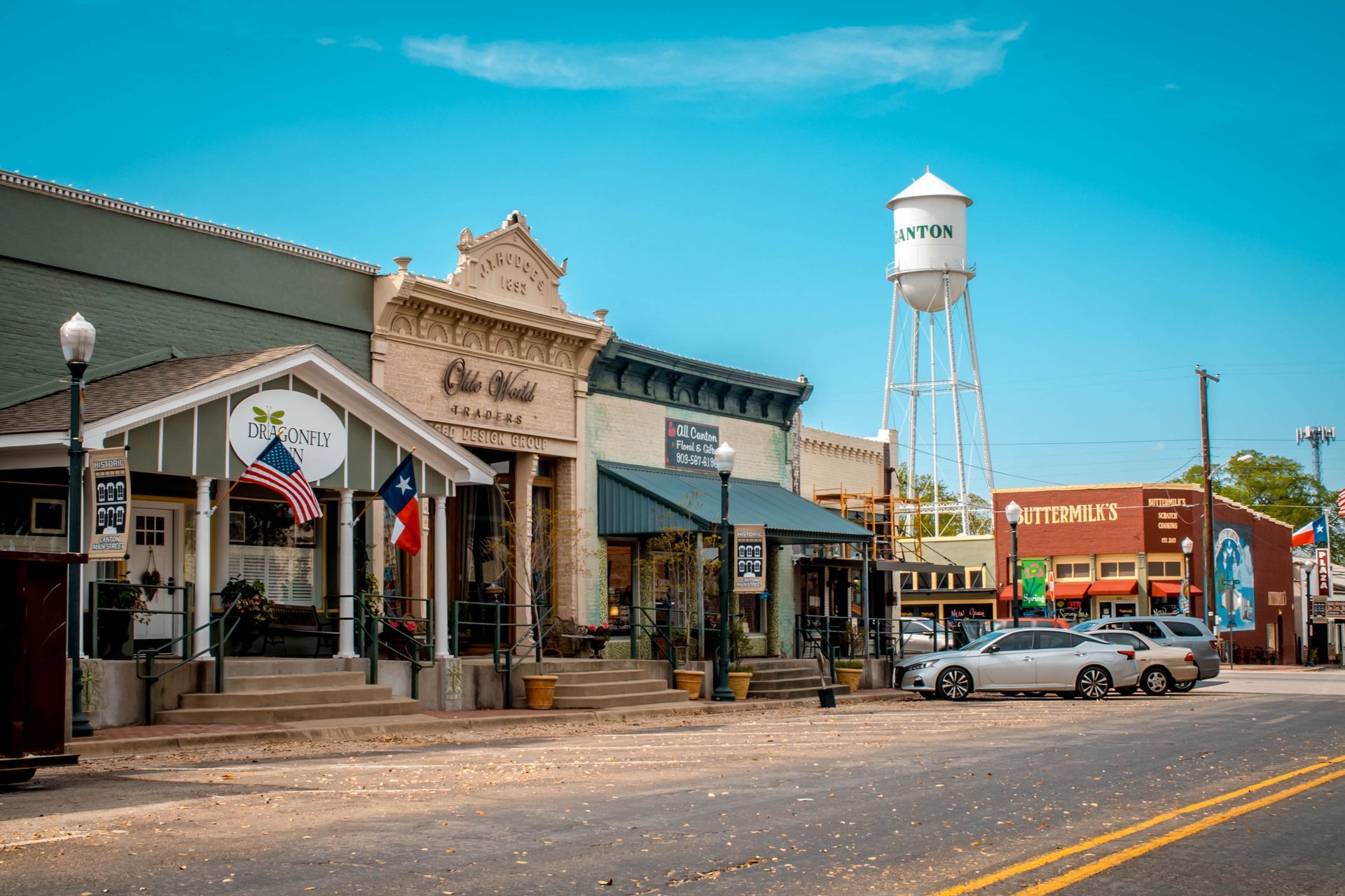 A white van with the number 2151 on the side is parked on the side of the road