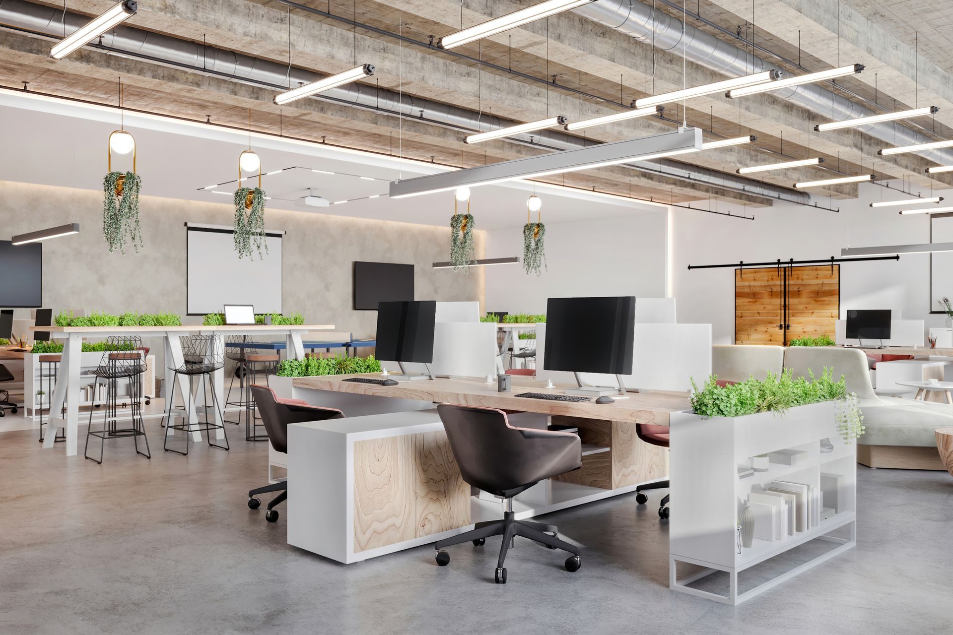 A large open office with lots of desks and chairs.