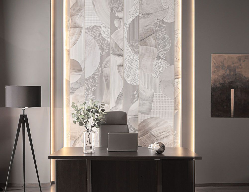 A pair of sunglasses with a gold frame and black lenses on a white background.