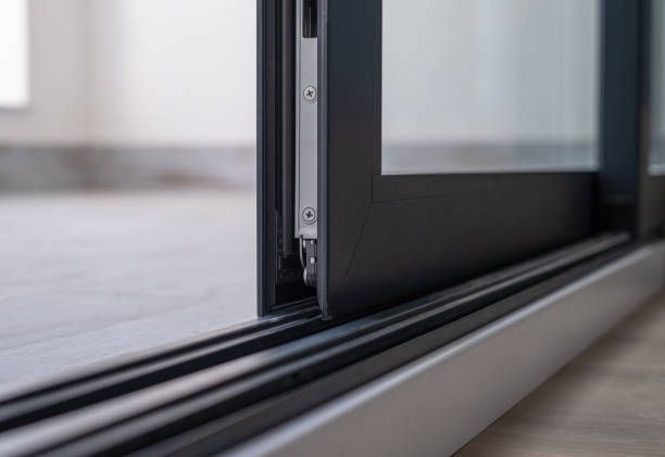 Close-up of an anthracite grey aluminium window with glass in a new house. 