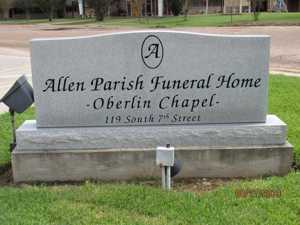 Granite sign for Allen Parish Funeral Home, Oberlin Chapel, on South 7th Street.
