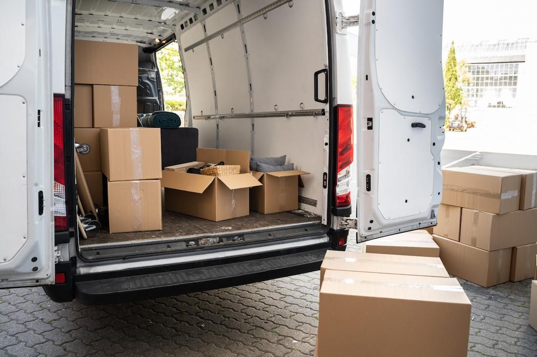 The Back of a Delivery Van is Filled With Cardboard Boxes — Dunford Removals in Miriam Vale, QLD