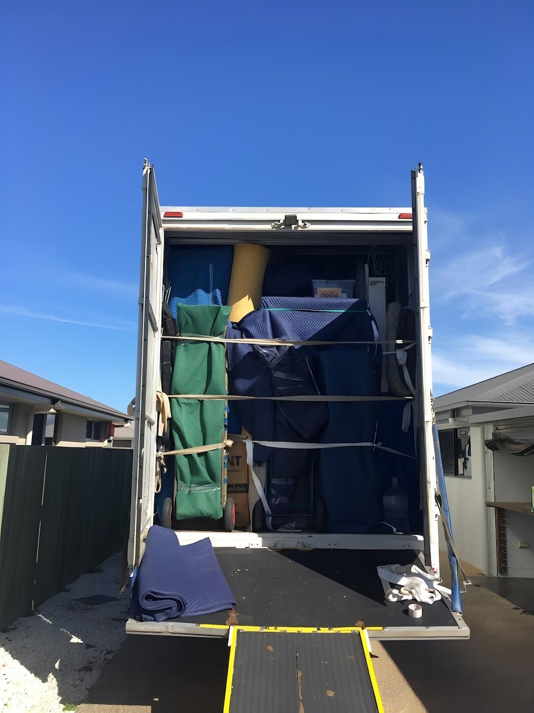 A Moving Truck is Filled With Lots of Furniture and Boxes — Dunford Removals in Woodgate, QLD