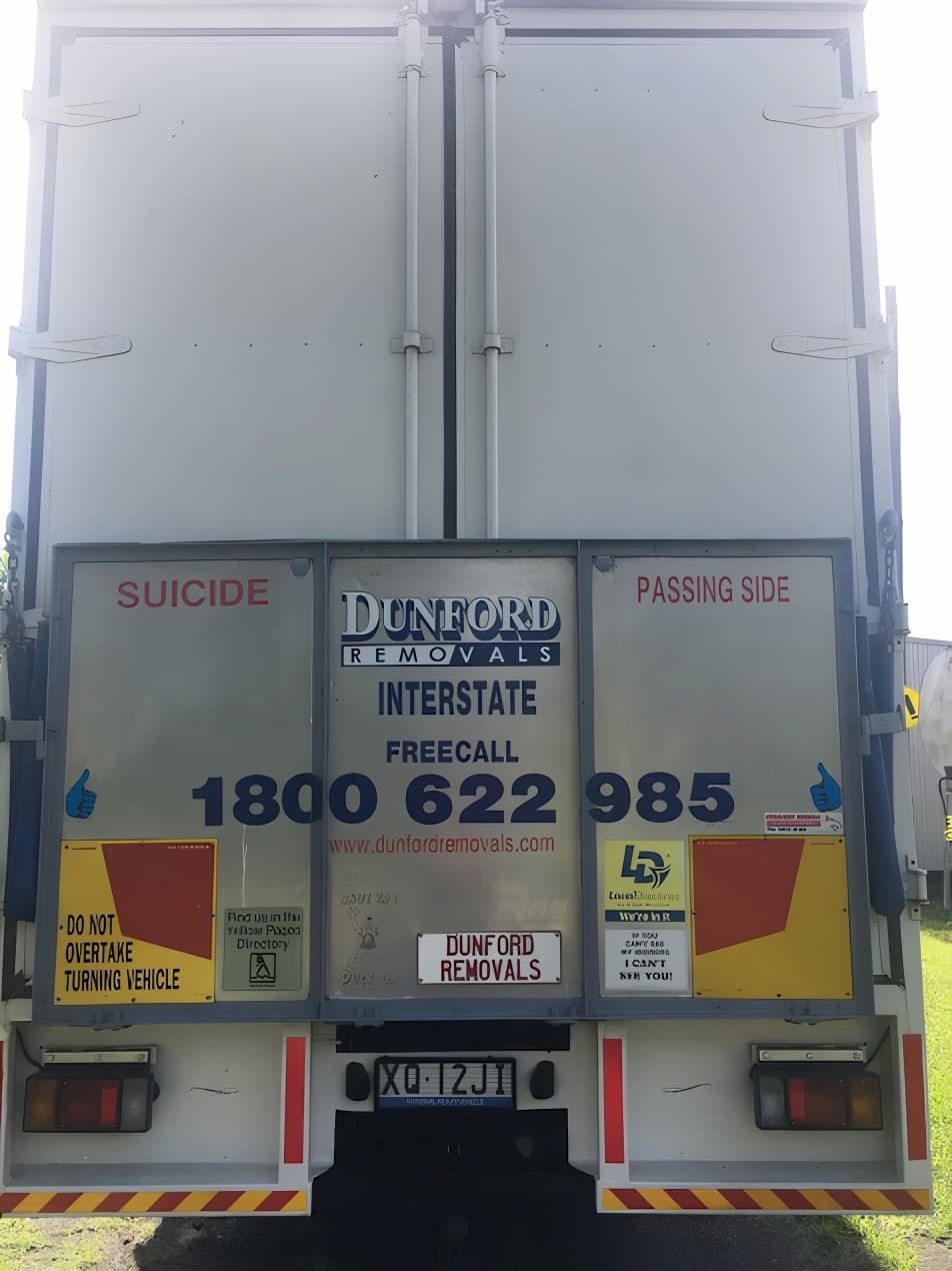 The Back of a Truck With Company Details On It — Dunford Removals in Qunaba, QLD