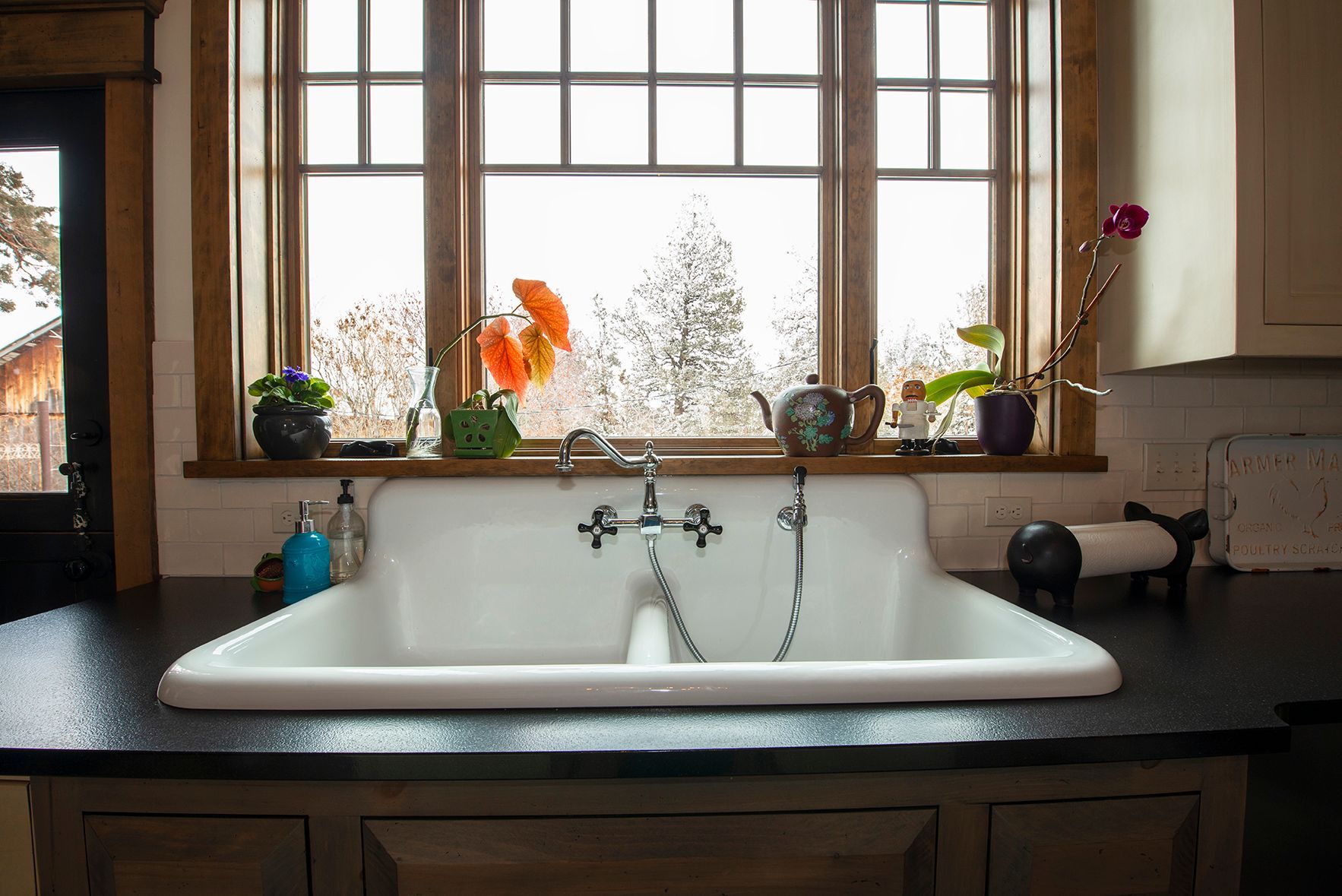 A kitchen sink with a window in the background
