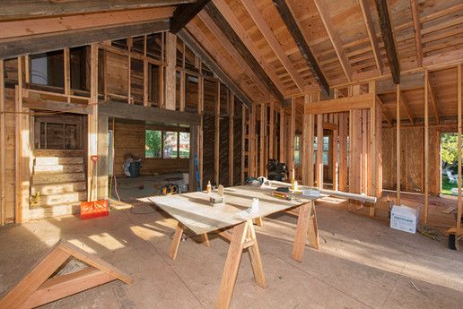 House under construction with a table in the middle of the room