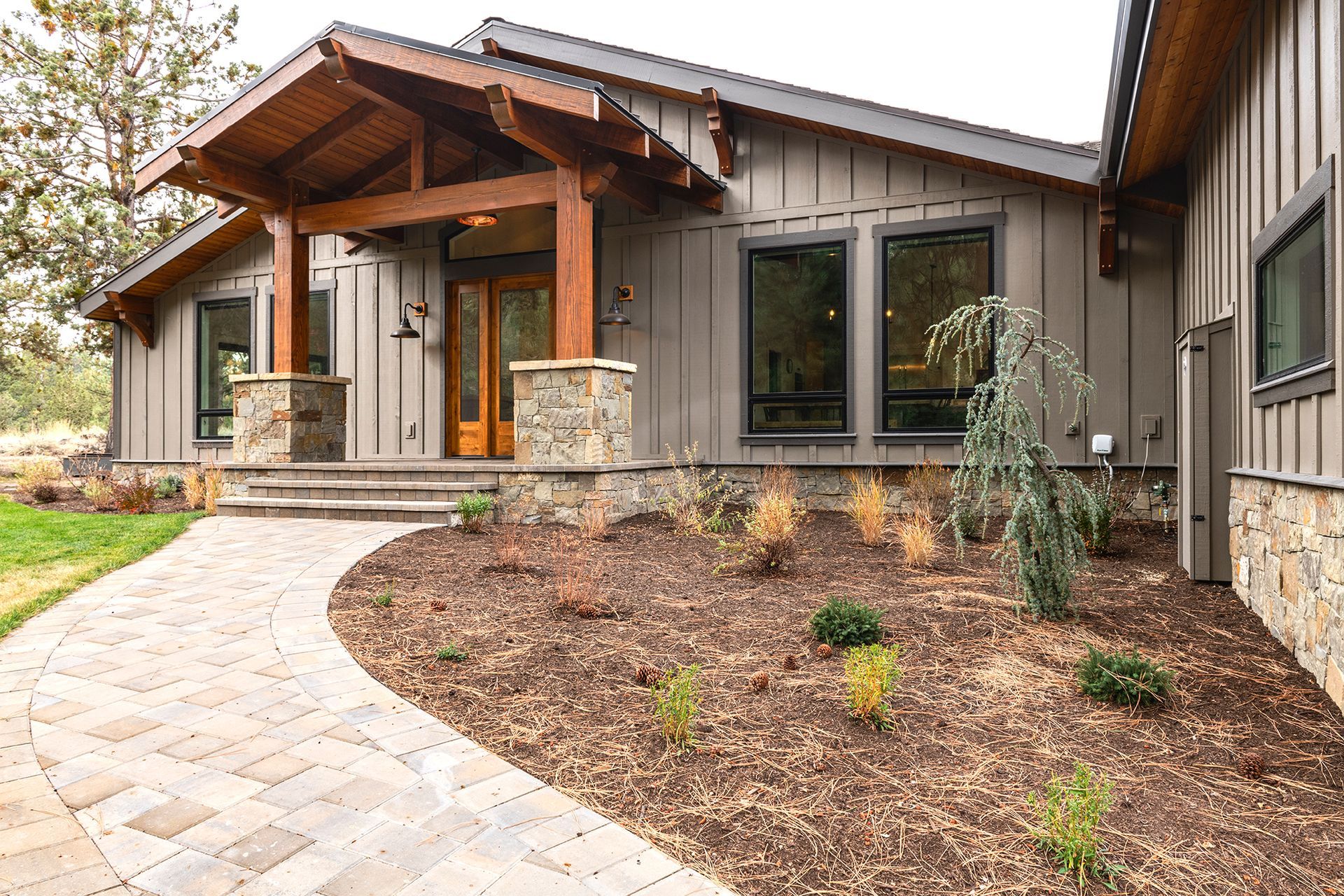 A large house with a stone walkway leading to it