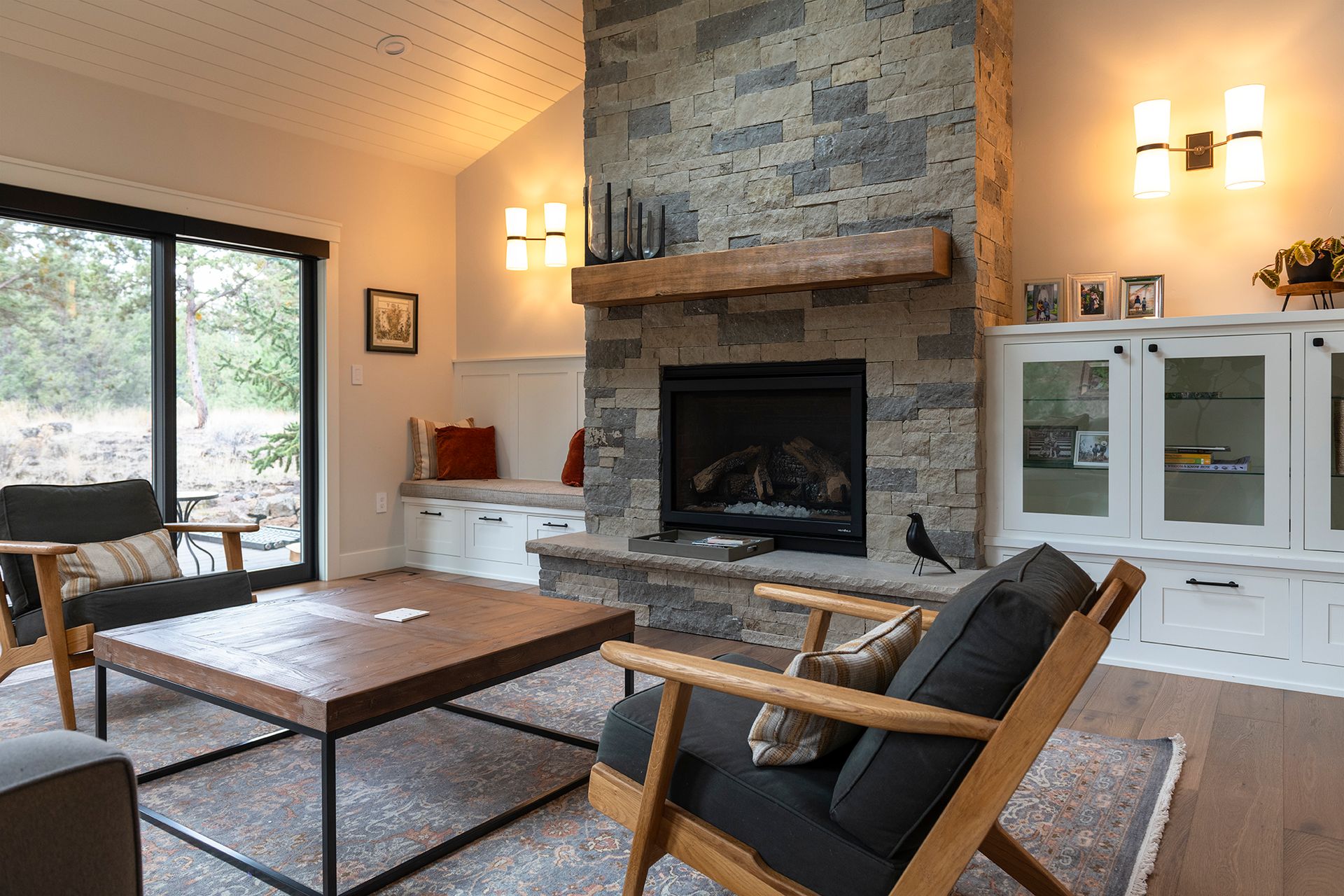 There is a fireplace in the middle of the living room.