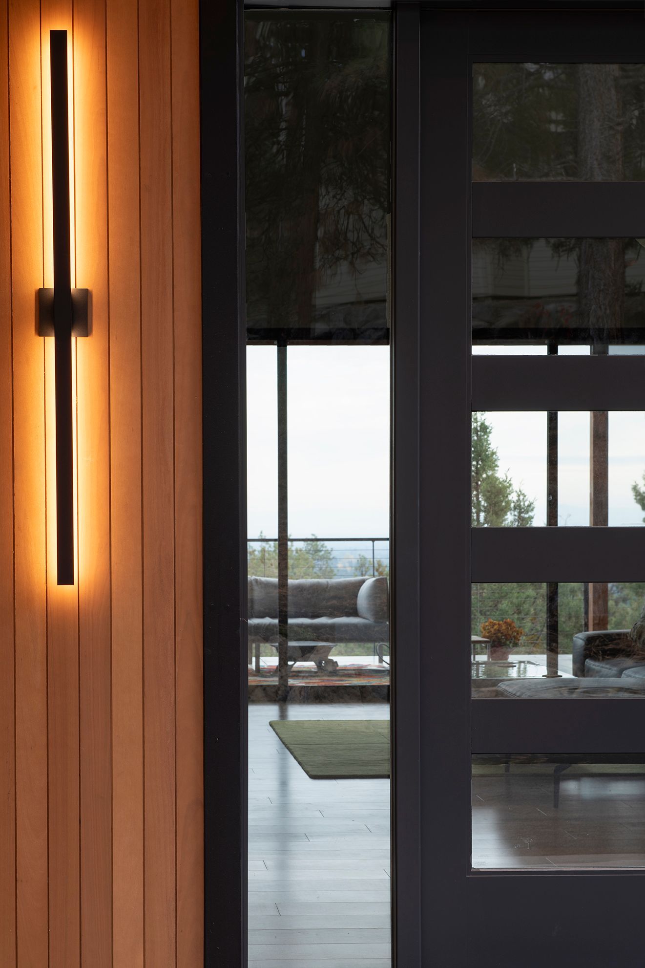 There is a light on the wall next to the door.