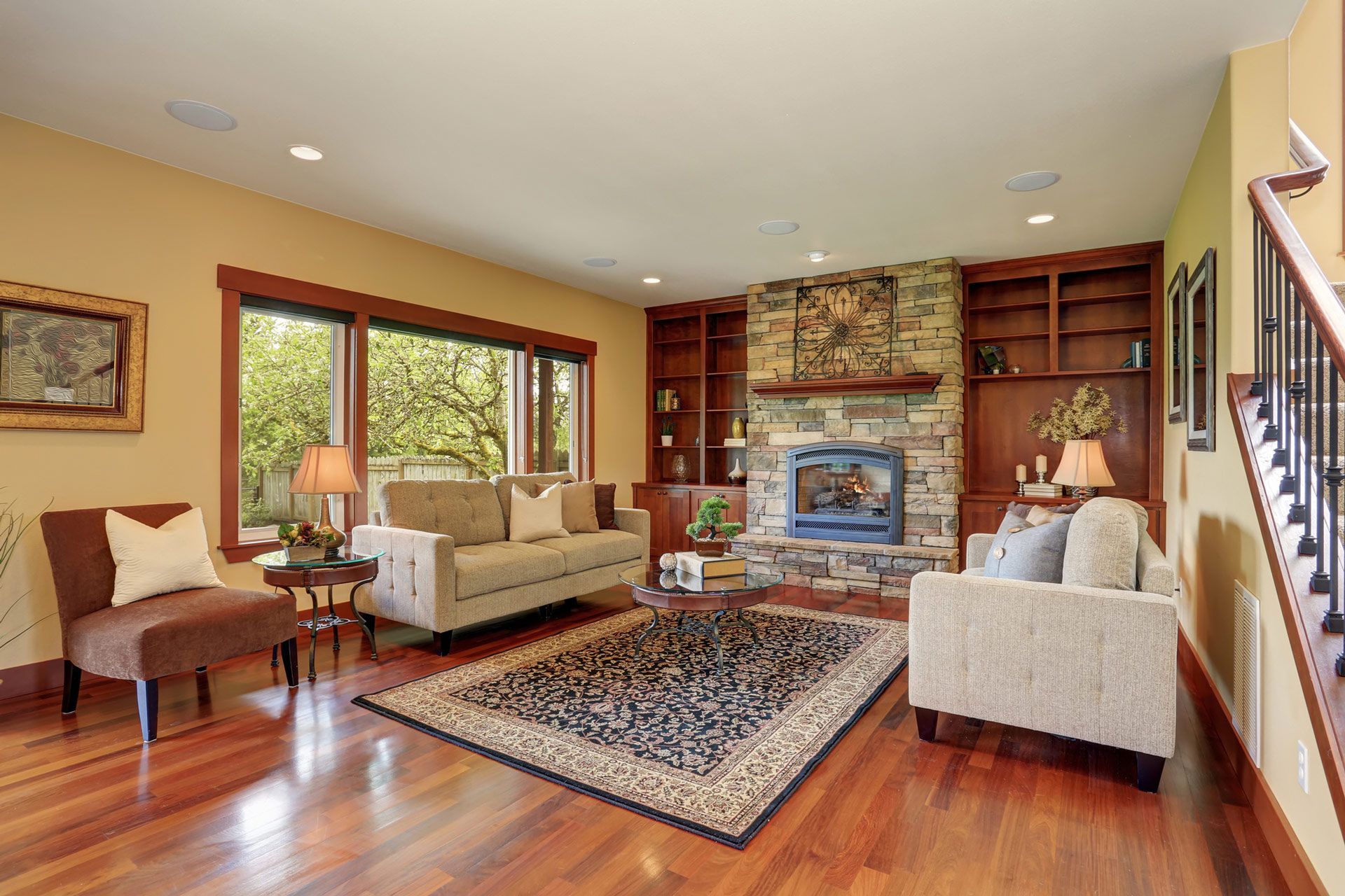 A living room with hardwood floors and carpet — Bend, OR — Ross Built Custom Homes