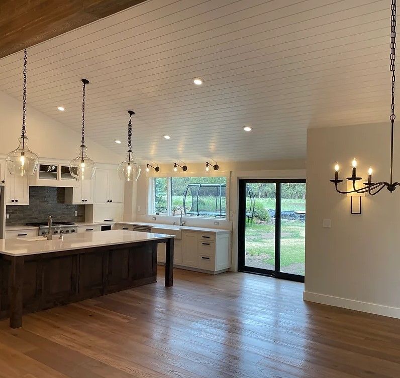 A kitchen with a large island — Bend, OR — Ross Built Custom Homes