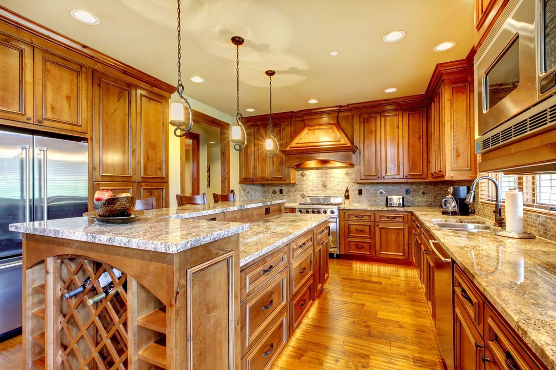 Kitchen Remodeling with Wooden Cabinets and Granite Counter Tops