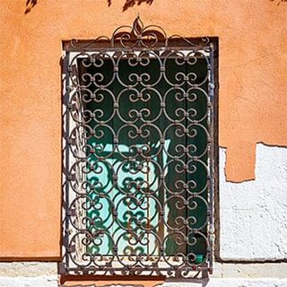 window with decorative wrought-iron grille — window guards in Torrance, CA