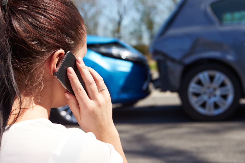 Woman Phoning Towing Service After Car Crash - Smash Repairs in Grafton, NSW