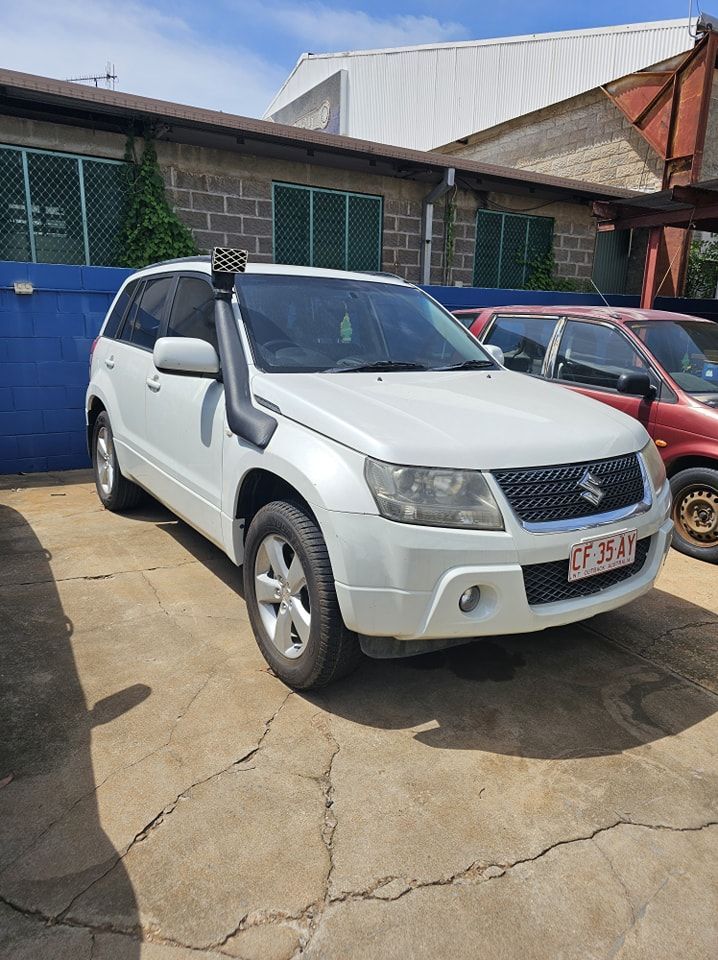A White SUV With A Snorkel Is Parked In Front Of A Building — Advanced Darwin Diesel Service In Darwin City, NT