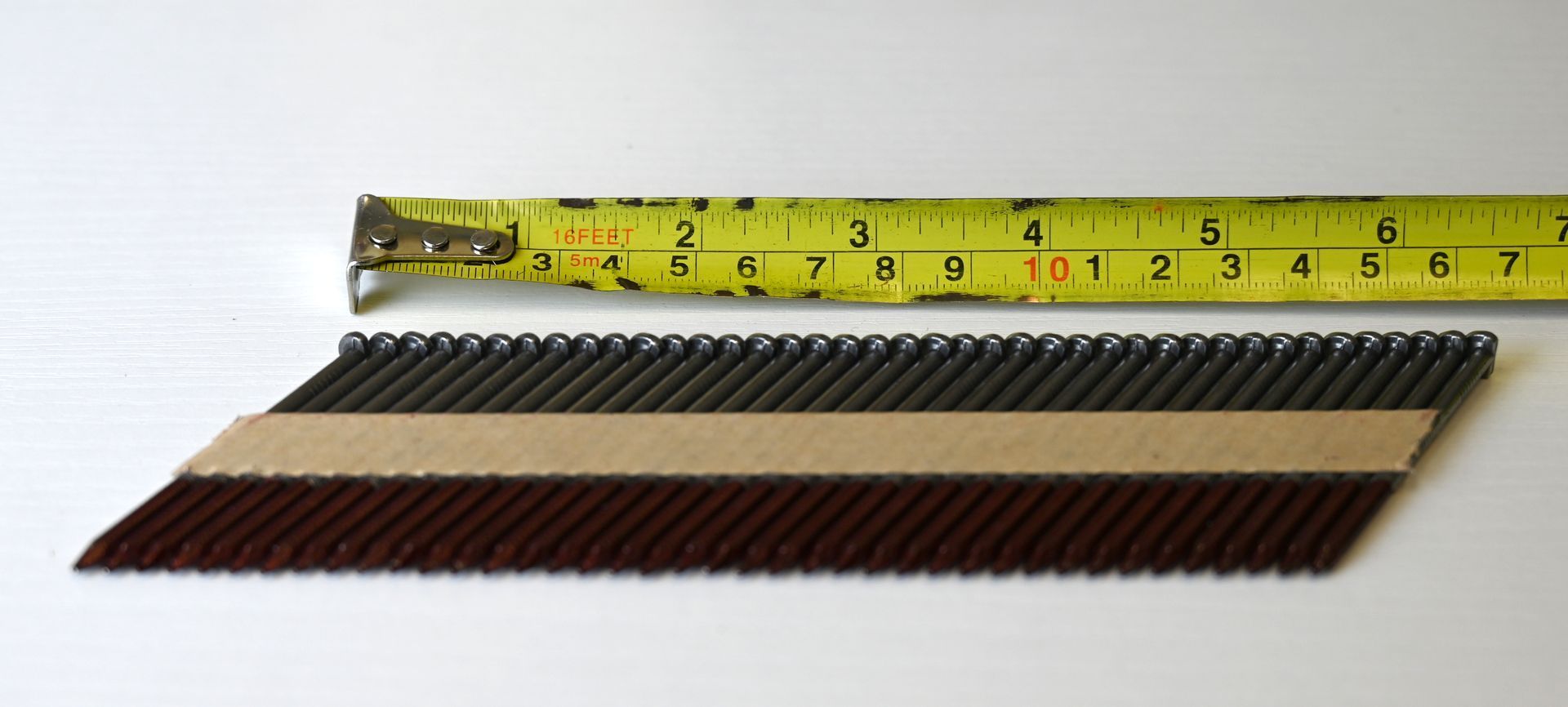 Three patterned fabric swatches folded into a V shape on a white background