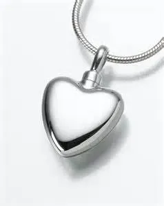 A silver heart shaped pendant on a chain on a white background.