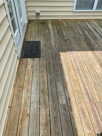 Wooden deck with visible weathering and discoloration
