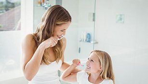 Sedation Dentistry — Brushing Teeth Together in Redding, CA
