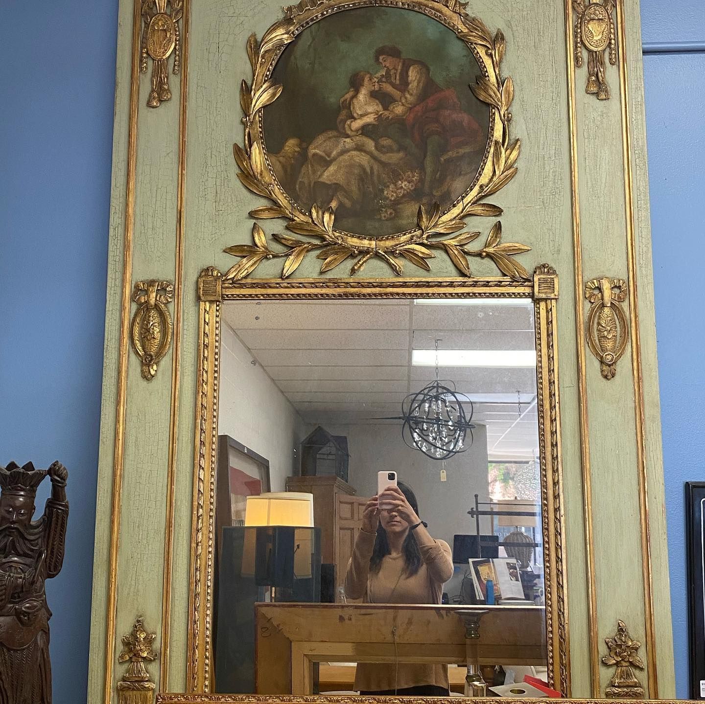 A woman is taking a picture of herself in a mirror