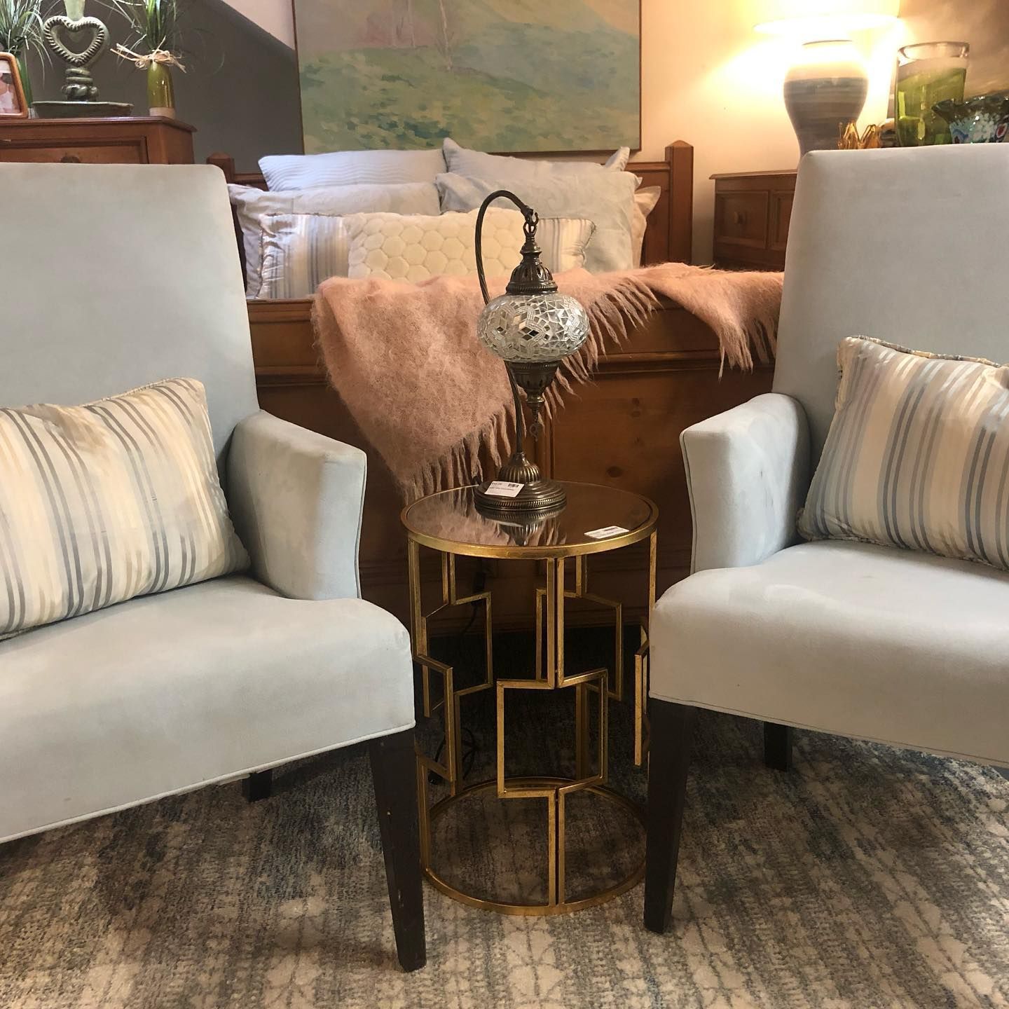 Two orange chairs are sitting next to each other in a living room.