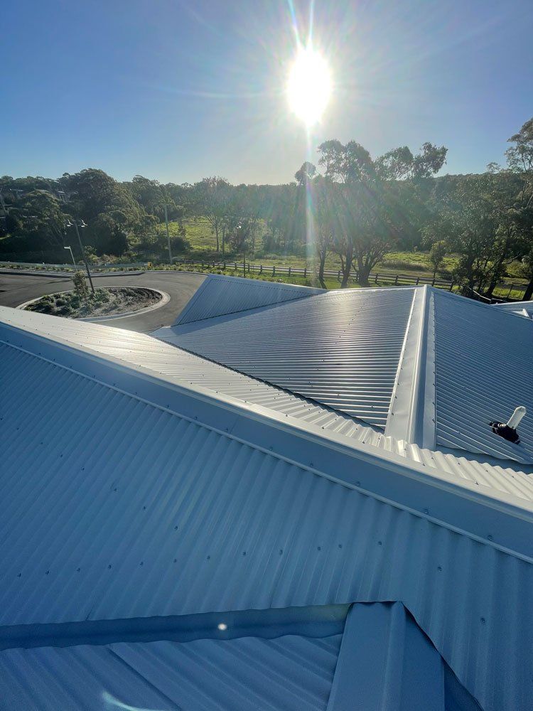 White Metal Roofing View Under The Sun — Roofing And Guttering In Newcastle, NSW