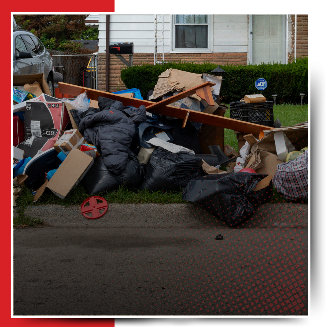 A pile of garbage outside the house.